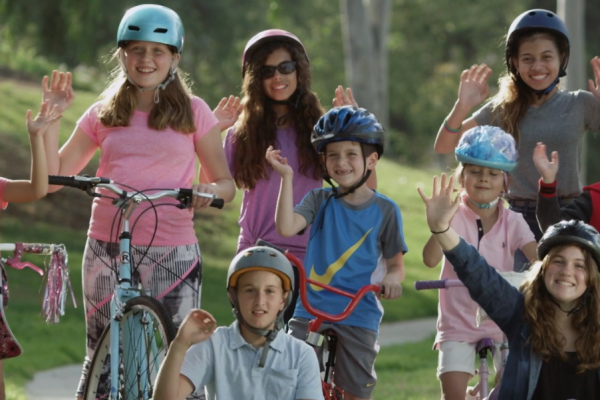 Smiling people on bicycles
