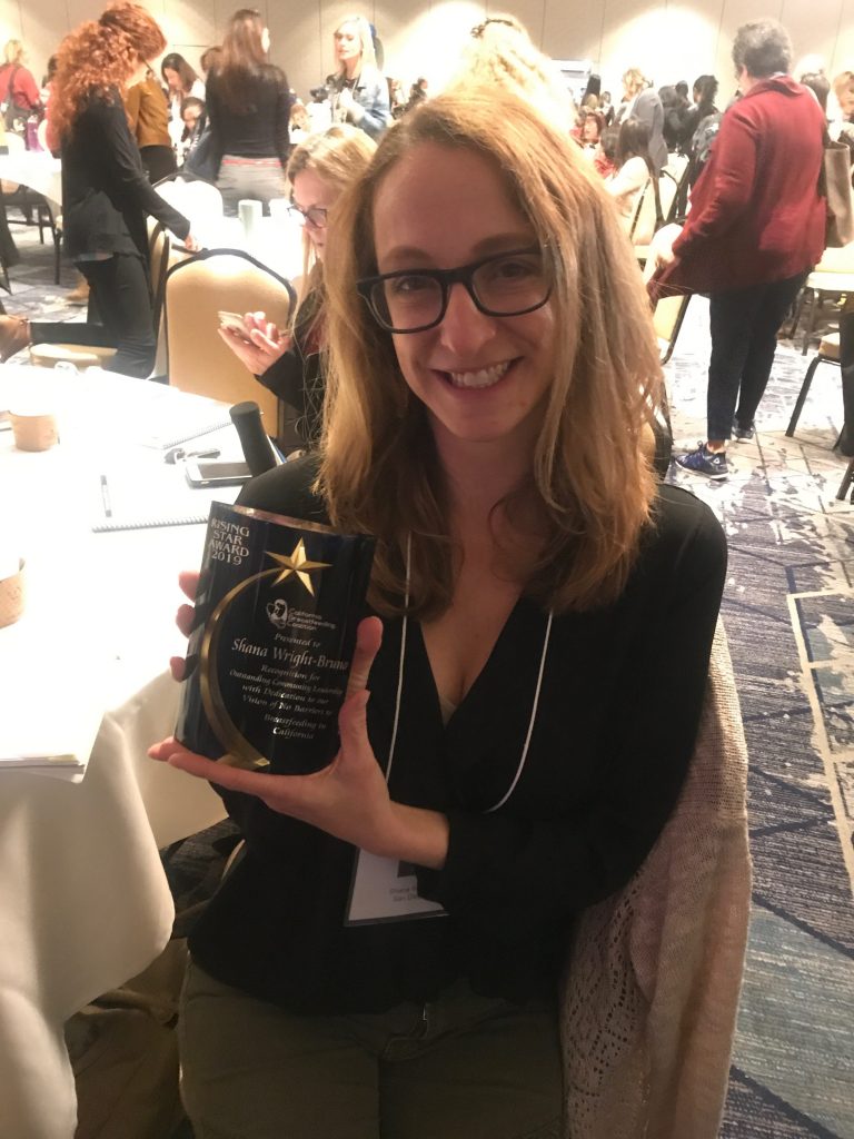 Shana holding a tumbler