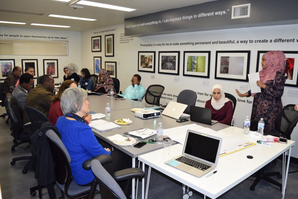 people sitting at conference table