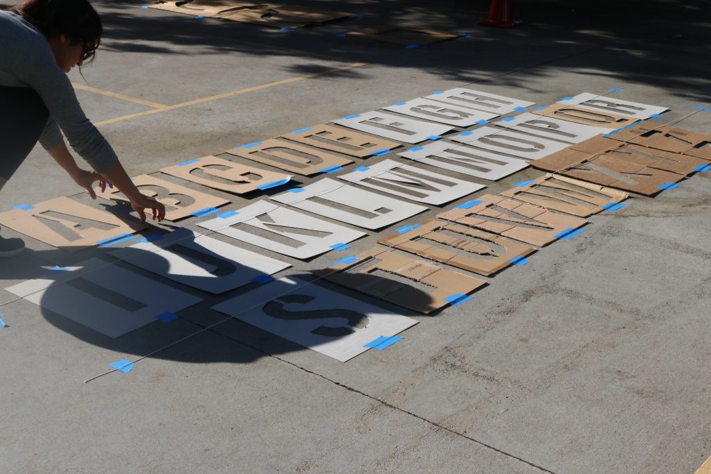 laying out cardboard cut-out letters
