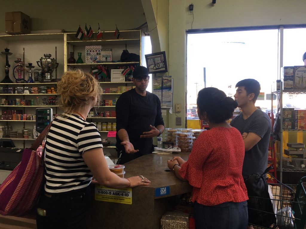 group of students talking in market