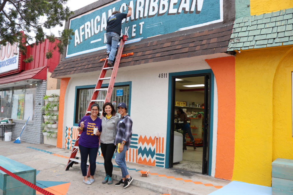 group photo while fixing sign