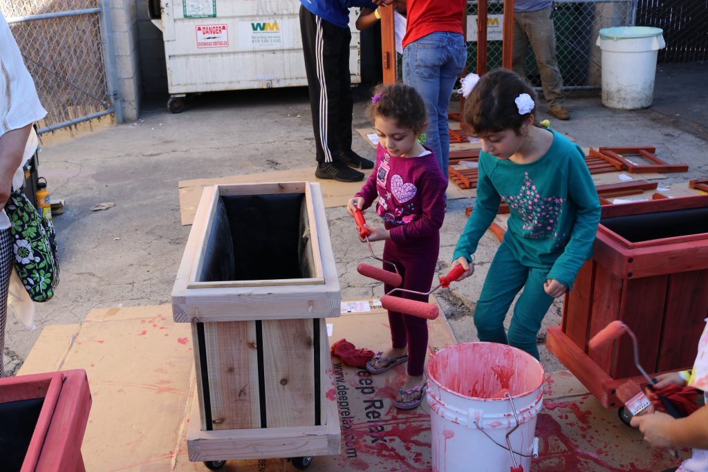 children painting outside