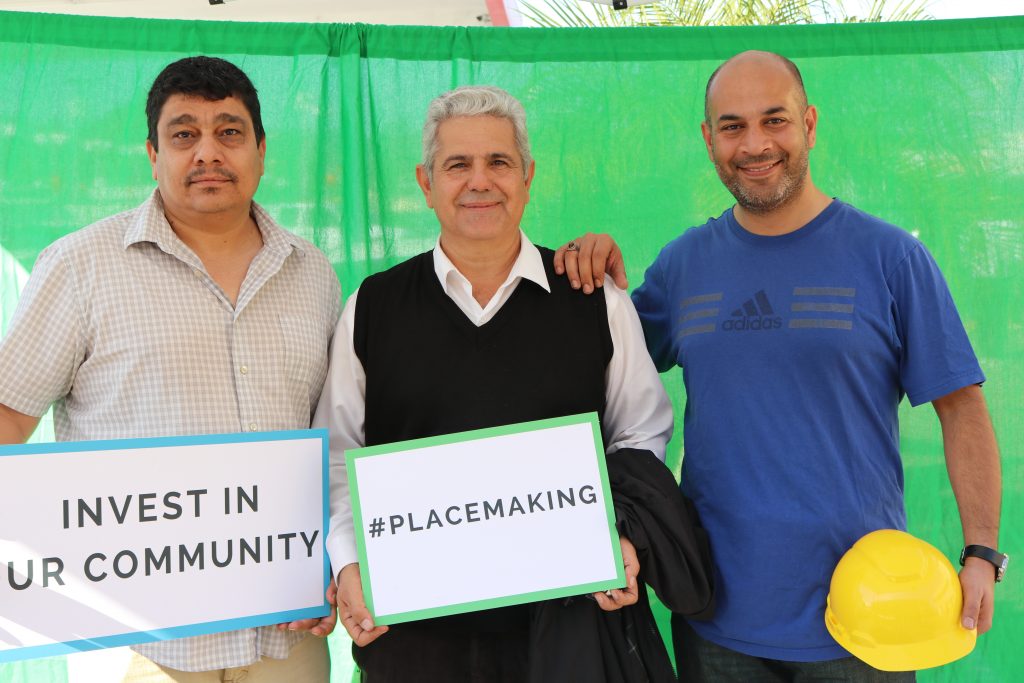 3 people smiling with placemaking posters