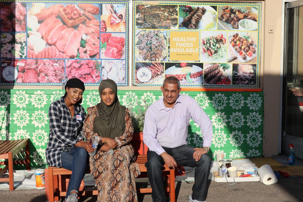 3 people sitting and smiling