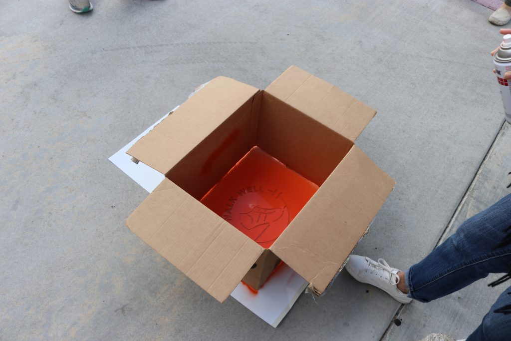 spray painted sign in box