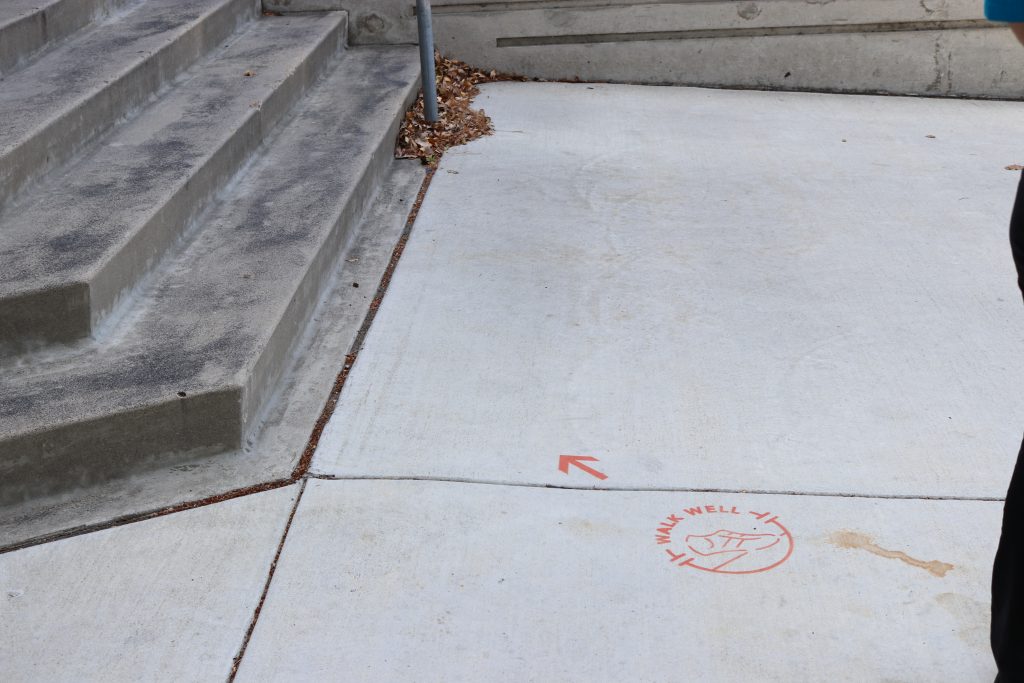 walk well marker on cement