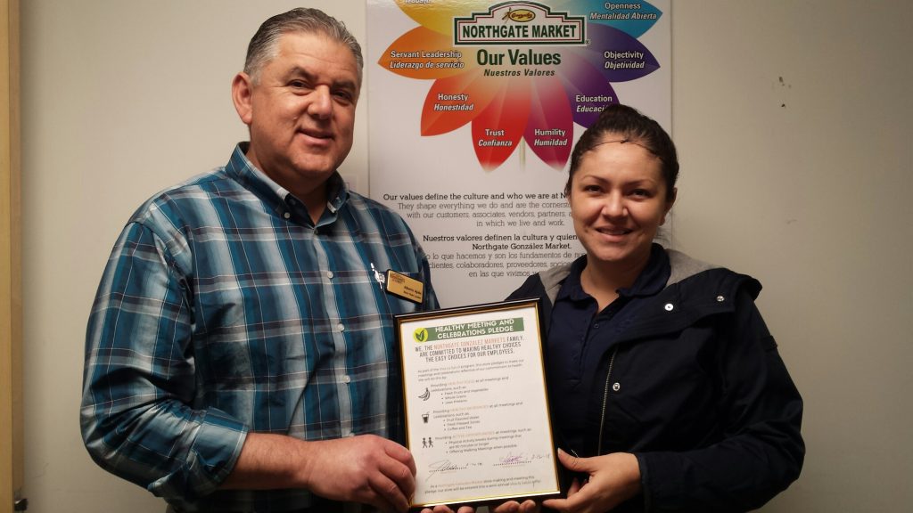 two people holding sign