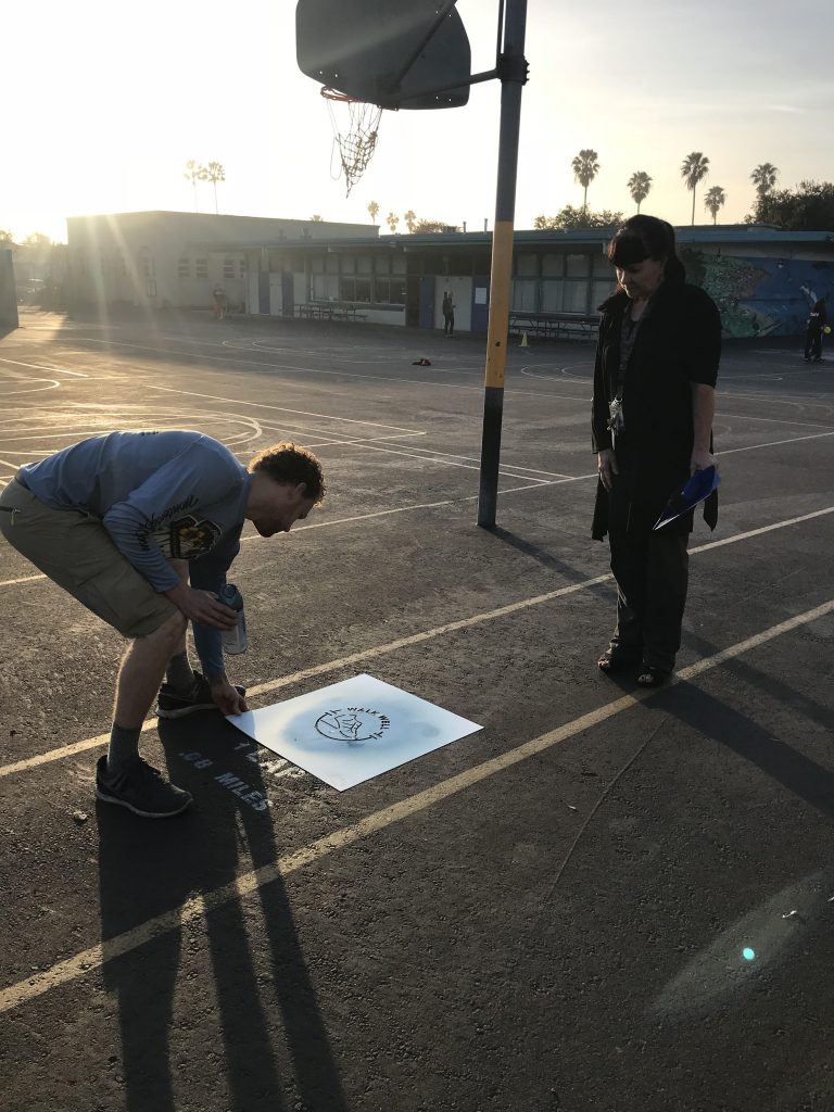 stenciling on side of basketball court