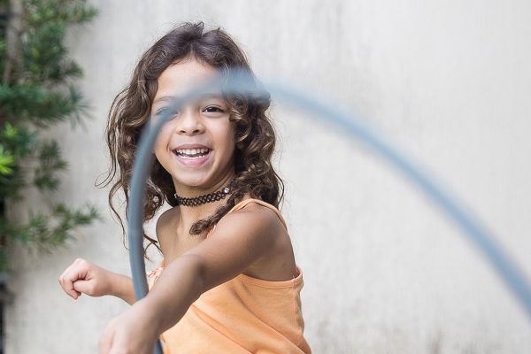 child with hula hoop