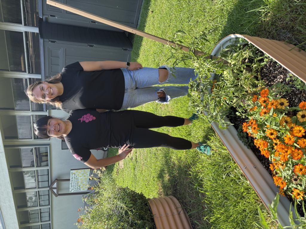 Christina Ng and Courtney Lamb in the school garden