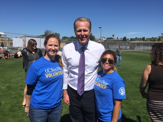 UC San Diego staff members Kate McDevitt and Kate Edra celebrate with Mayor Kevin Faulconer.